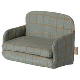 Children's dollshouse armchair with a grid pattern on a white background