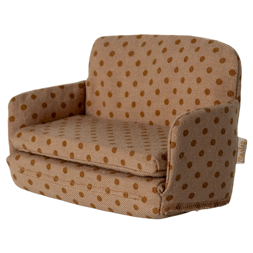 Children's dollshouse chair with brown polka dot pattern on a white background