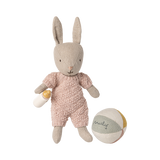Stuffed bunny toy in a pink outfit with a ball on a white background