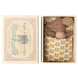 Small stuffed maileg mouse toy in a decorative matchbox 